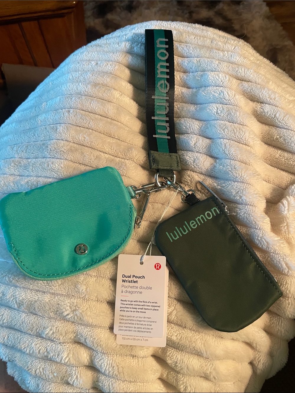 lululemon striped logo wristlet in teal and dark green